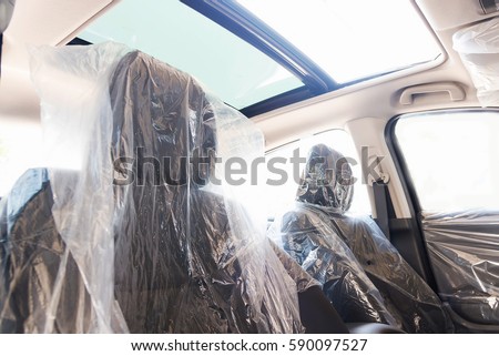 Car inside. Interior of prestige modern car. Comfortable leather seats of plastic cover and panoramic roof. Royalty-Free Stock Photo #590097527
