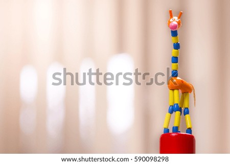 toy giraffe in background brown
