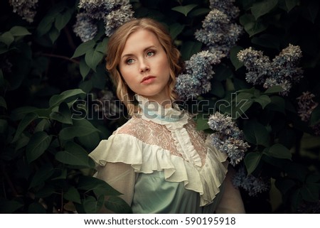 the girl in the blue dress in the garden