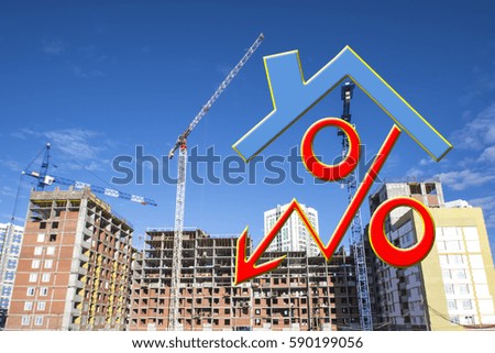 The percent sign in the background of the construction of the house. The concept of price changes on the real estate market.