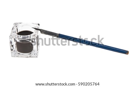 old fountain pen and inkwell isolated on white background closeup