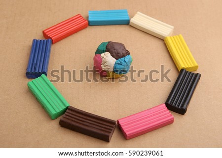 Children's colored plasticine. Materials for creativity. Colorful plasticine ball and circle.