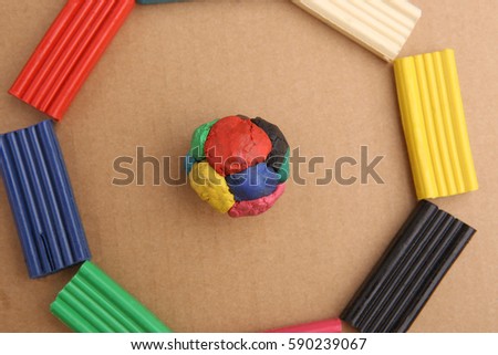 Children's colored plasticine. Materials for creativity. Colorful plasticine ball and circle.