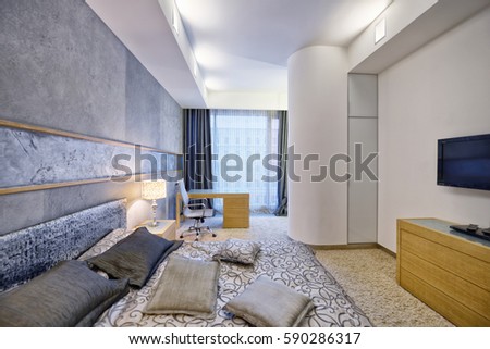 Russia, Moscow - modern designer renovation in a luxury building. Stylish bedroom interior with king sized bed