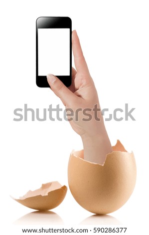 Hand with broken egg isolated on white 