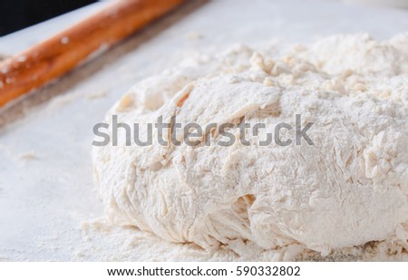 woman kneads dough