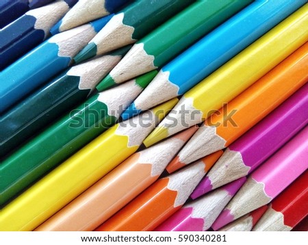 Color pencils isolated on white background. Close up, selective focus, blur image  