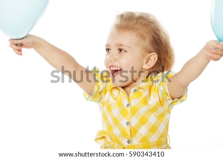Full isolated studio picture from a little girl with blue balloons