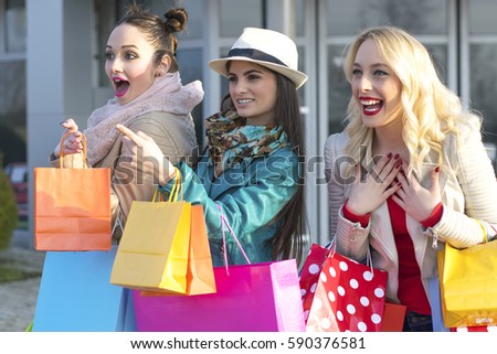 Happy Young Women with Shopping Bags