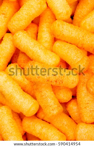Cheese puff. Cheese puffs snack background texture food pattern.