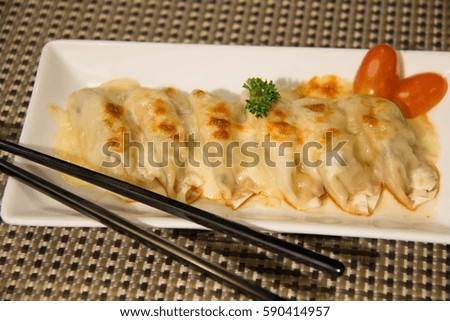 gyoza Dumplings bake cheese Traditional Asian Food, Stuffed with Pork Meat or Vegetables
