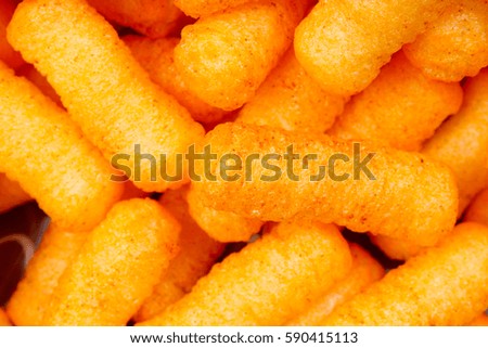 Cheese puff. Cheese puffs snack background texture food pattern.