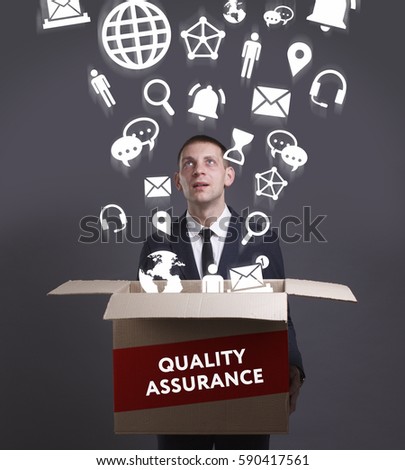 Business, Technology, Internet and network concept. Young businessman shows the word: Quality assurance