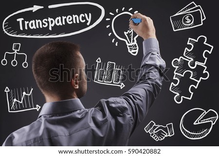 Technology, internet, business and marketing. Young business man writing word: Transparency