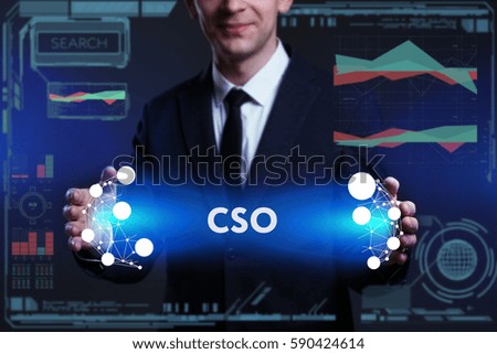 Business, Technology, Internet and network concept. Young businessman working on a virtual screen of the future and sees the inscription: CSO