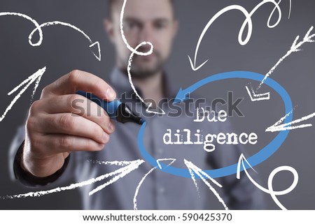 Technology, internet, business and marketing. Young business man writing word: Due diligence