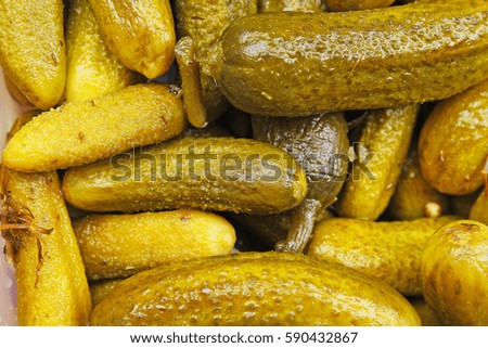 Pickles as background. Green pickle texture pattern. 
pickled cucumber,