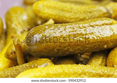 Pickles as background. Green pickle texture pattern. 
pickled cucumber,
