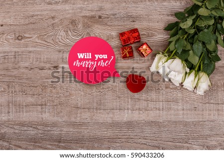 Roses with heart engagement box. Will you marry me design. Valentines day concept. Fresh natural flowers with gift boxes. Wooden rustic board.