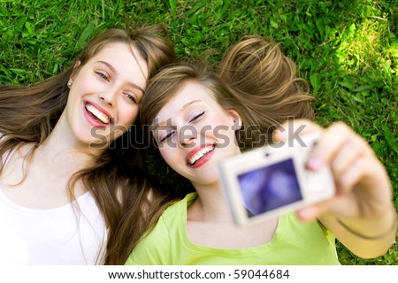 Two friends taking pictures