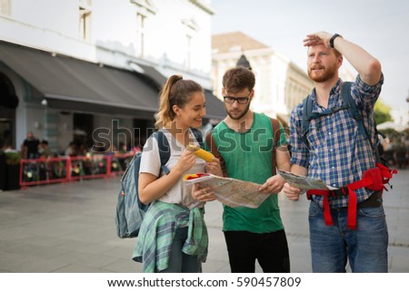 Young traveling people having fun and sightseeing  in city