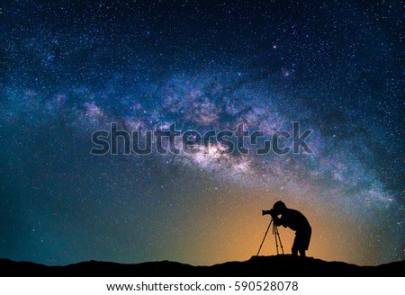 Landscape with Milky way galaxy. Night sky with stars and Photographer take photo on the mountain.