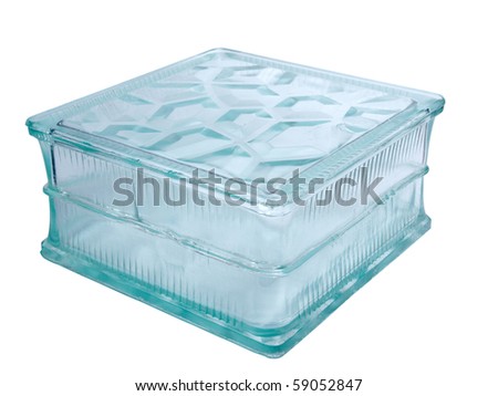 Color photo of a glass block for construction on a white background