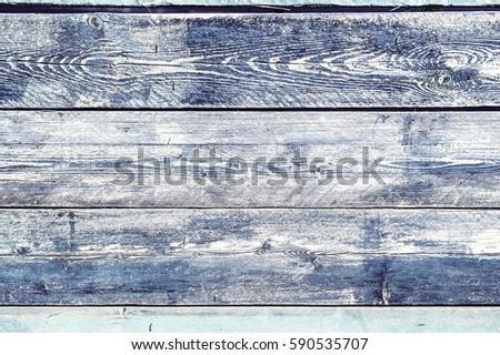 Texture of old wooden fence painted in blue color