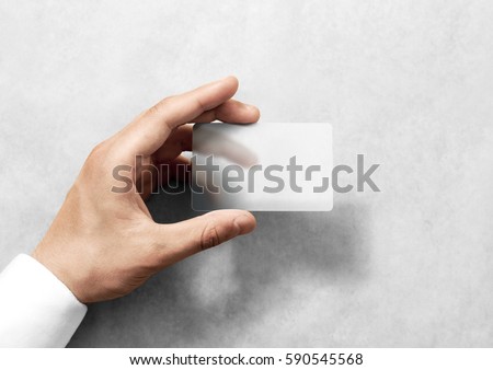 Hand hold blank translucent card mockup with rounded corners. Plain clear call-card mock up template holding arm. Plastic transparent acrylic namecard display front. Royalty-Free Stock Photo #590545568