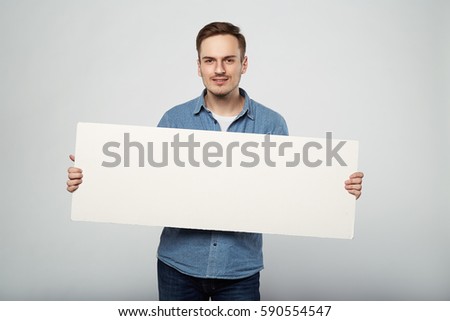 man holds the white sign in a studio white background