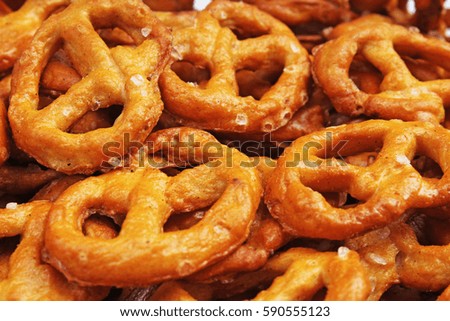 Pretzel shaped bread sticks cracker texture pattern. Salted pretzels.
