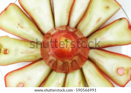 Local jambu air or fresh wax apple in a bowl with slices cut isolated on white background