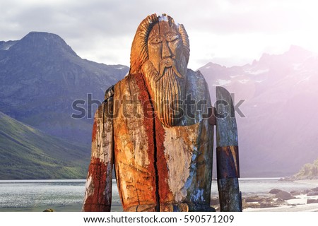 Odin isolated on the shore of fjord,sagas, mythology, monuments, idols, Odin, Scandinavia, creation the supreme god Royalty-Free Stock Photo #590571209