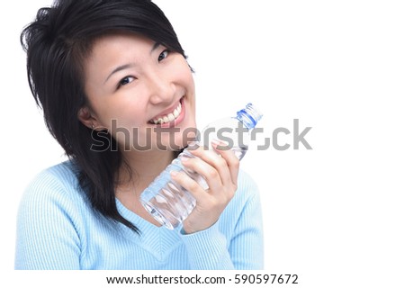 Young woman with bottle of water, smiling