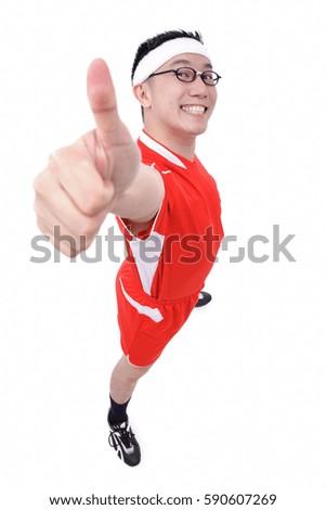 Man in soccer uniform making thumbs up sign