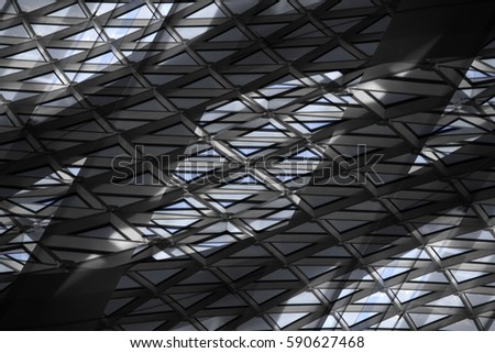 Transparent roof with girders. Reworked photo of structural glass ceiling with triangular pattern. Abstract background on the subject of modern industrial or office architecture