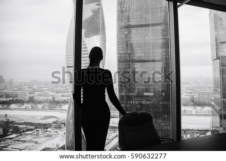 silhouette of a girl on the background of skyscrapers 1