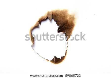 burnt hole in a paper Royalty-Free Stock Photo #59065723