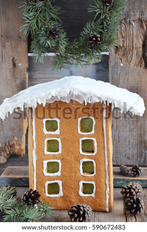 Christmas gingerbread house on a wooden background. selective focus