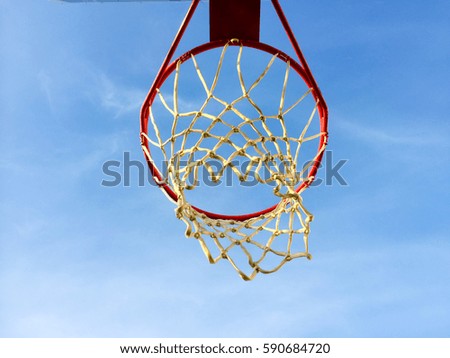 Blue sky and basketball hoop outdoors background