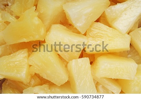 
Pineapple slices as background. Yellow pineapples texture pattern.