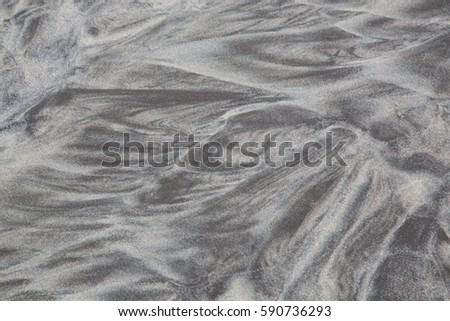 Water and waves made fantastic design from sand. 