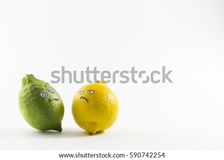Fresh green and yellow lemons with sour cartoon style faces on white background
