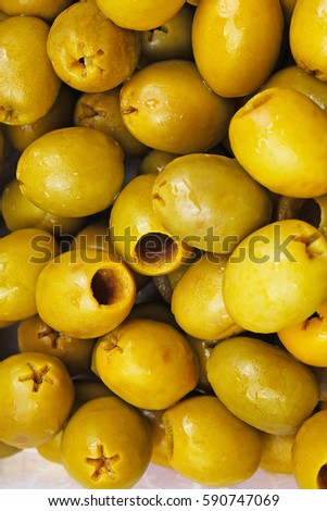 Olive texture. Olives as background. Shiny green olives. Olive wallpaper pattern texture.