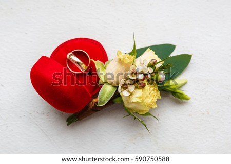 bridal boutonniere of roses with rings