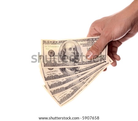 600 dollars in the hand over white  background