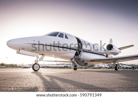 Luxury business jet ready for boarding Royalty-Free Stock Photo #590791349