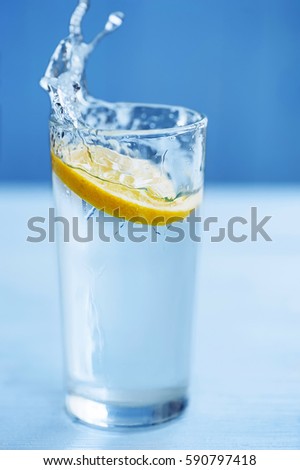 fresh cool water pouring into glass 