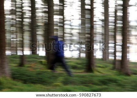 Blurred picture - A man in the forest