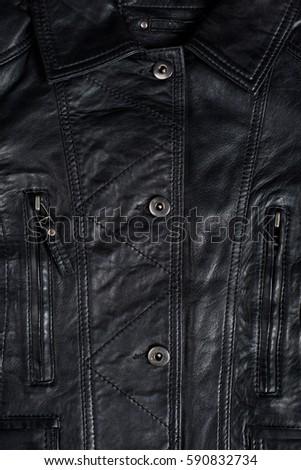 Black leather jacket. Leather jacket macro details. Jacket zippers and pockets